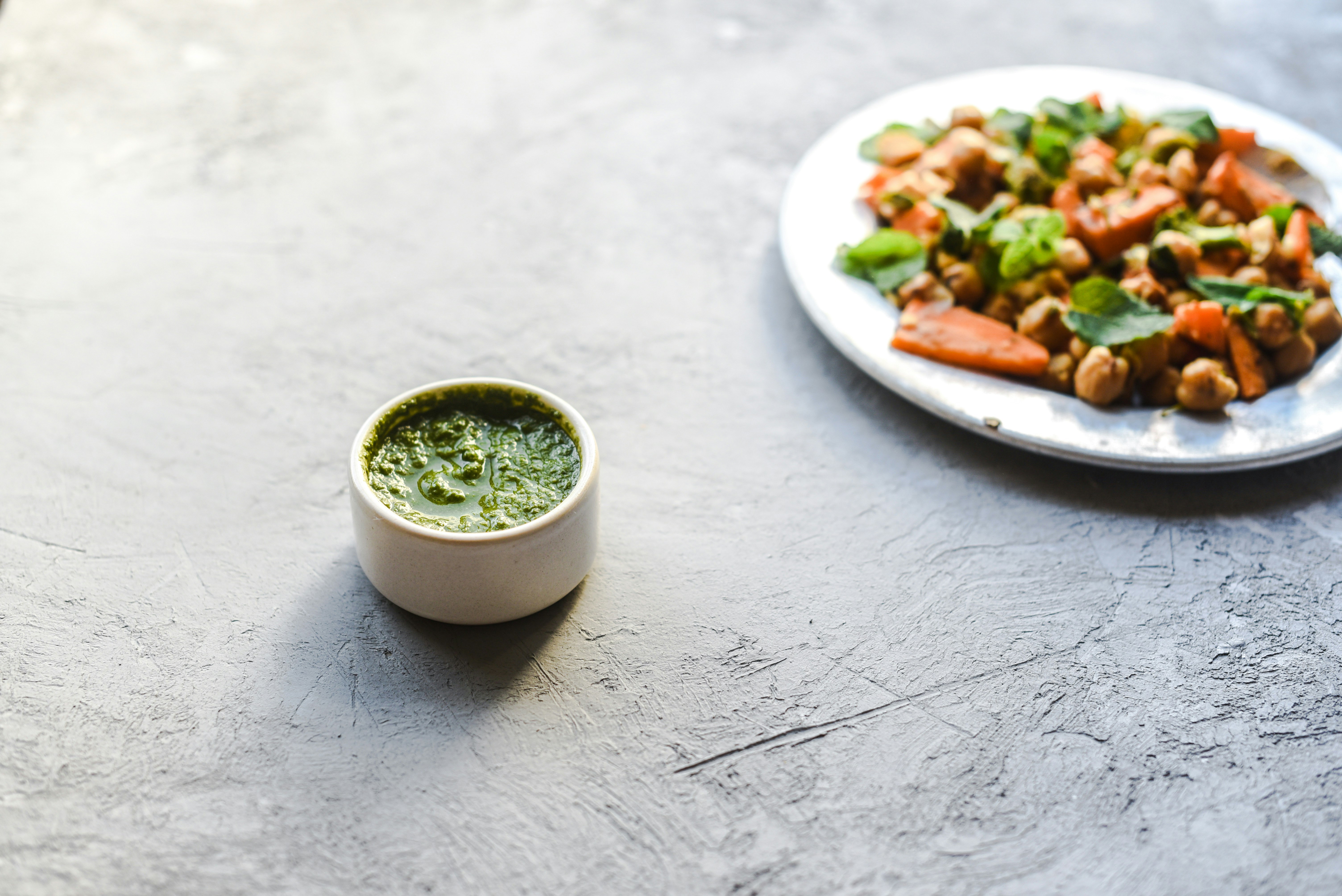 green soup in white ceramic bowl